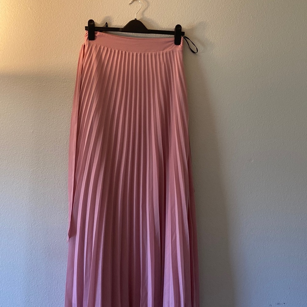 Full length pleated pink skirt